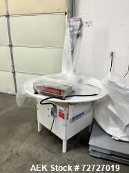 https://www.aaronequipment.com/Images/ItemImages/Packaging-Equipment/Unscramblers-Accumulation-Tables/medium/Smalley-Rotary_72727019_aa.jpeg