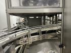 Used Used- Hartness Model Dynac 6400 Spiral First-In First-Out (FIFO) Accumulation Line for beverage containers.  Is capable of running products with a maximum product height range of 1