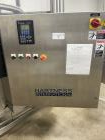 Used Used- Hartness Model Dynac 6400 Spiral First-In First-Out (FIFO) Accumulation Line for beverage containers.  Is capable of running products with a maximum product height range of 1