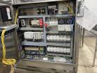 Used Used- Hartness Model Dynac 6400 Spiral First-In First-Out (FIFO) Accumulation Line for beverage containers.  Is capable of running products with a maximum product height range of 1