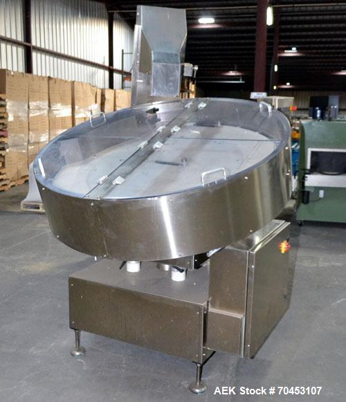 Used Ozaf AC/1500 Bottle Unscrambler, capacity approximately 170-180 units per minute. Includes an OZAF integrated elevator model E/10AG. SELLING PRICE AS IS, WHERE IS, SANFORD, NC.