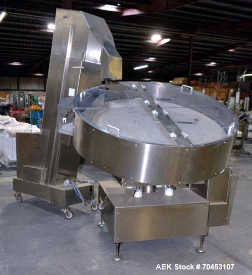 Used Ozaf AC/1500 Bottle Unscrambler, capacity approximately 170-180 units per minute. Includes an OZAF integrated elevator model E/10AG. SELLING PRICE AS IS, WHERE IS, SANFORD, NC.