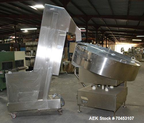 Used Ozaf AC/1500 Bottle Unscrambler, capacity approximately 170-180 units per minute. Includes an OZAF integrated elevator model E/10AG. SELLING PRICE AS IS, WHERE IS, SANFORD, NC.
