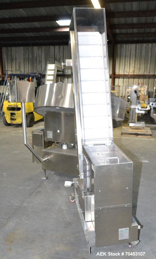 Used Ozaf AC/1500 Bottle Unscrambler, capacity approximately 170-180 units per minute. Includes an OZAF integrated elevator model E/10AG. SELLING PRICE AS IS, WHERE IS, SANFORD, NC.