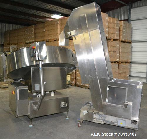 Used Ozaf AC/1500 Bottle Unscrambler, capacity approximately 170-180 units per minute. Includes an OZAF integrated elevator model E/10AG. SELLING PRICE AS IS, WHERE IS, SANFORD, NC.
