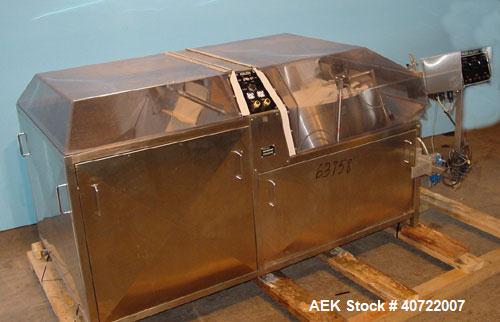 Used Kalish Bottle Unscrambler, model 7400, stainless steel. Feeds containers at up to 100 CPM, 42'' x 32'' x 22'' bulk hopper with 12'' x 28'' flighted rubber elevator belt, 3'' flights spaced 6'' o...