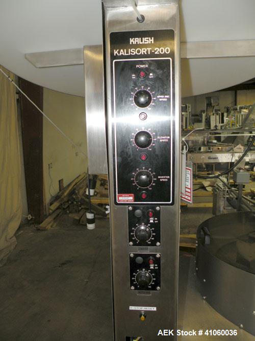 Used Kalish Kalisort-200 Bottle Orienter, Model 7430. Approximately 200 bottles per minute. Includes a starwheel, 4’’ wide x 74’’ long takeaway conveyor, and a stainless steel hopper, serial# 0012. I...