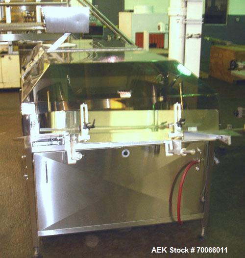 Used DT Kalish Kalisort 7400 bulk bottle unscrambler with DT Kalish model 999 inoized air cleaner bottle inverter and twin nozzle cleaning head, serial# 0001. (1) DT Kalish unscrambler, model 7400. I...