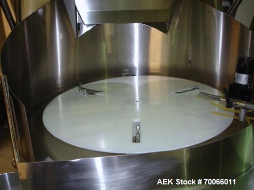 Used DT Kalish Kalisort 7400 bulk bottle unscrambler with DT Kalish model 999 inoized air cleaner bottle inverter and twin nozzle cleaning head, serial# 0001. (1) DT Kalish unscrambler, model 7400. I...