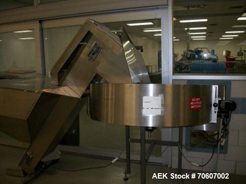 Used Kapsall Automatic Bottle Unscrambler, Model AU5C, all stainless steel. Features air cleaner, 48" hper & bow, adjustable positioning orientation bowl and elevator to accommmodate large bottles; f...