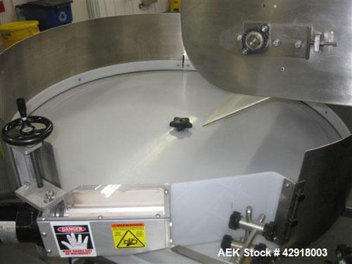 Used Kapsall Model AU6 bulk bottle unscrambler with integrated bottle elevator. Low profile design. Can Orient bottles from 1/16 oz to Gallons with proper changeparts. Last running 8/16 oz bottle wat...
