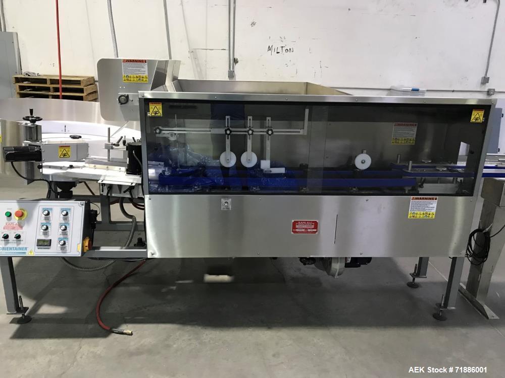 Used Kaps-All Orientainer Plastic Bottle Unscrambler, Model AU-6. Includes: 36" prefeeder, 12" elevator, 15 cubic hopper. Automatic Bottle Cleaner installed.