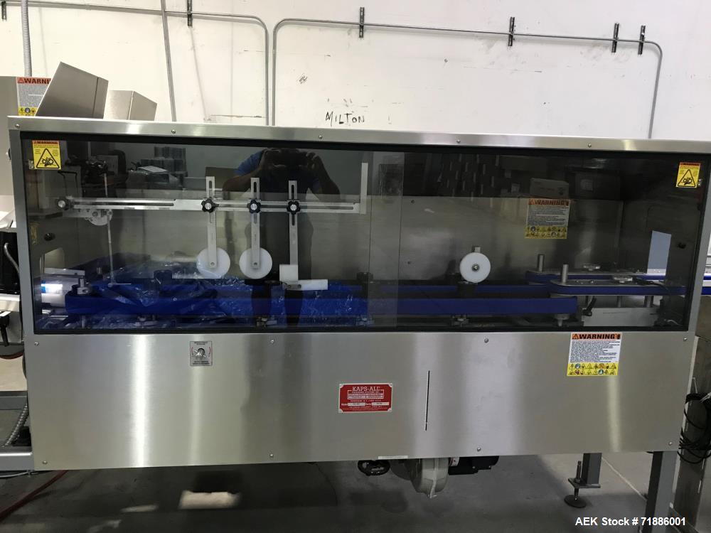 Used Kaps-All Orientainer Plastic Bottle Unscrambler, Model AU-6. Includes: 36" prefeeder, 12" elevator, 15 cubic hopper. Automatic Bottle Cleaner installed.