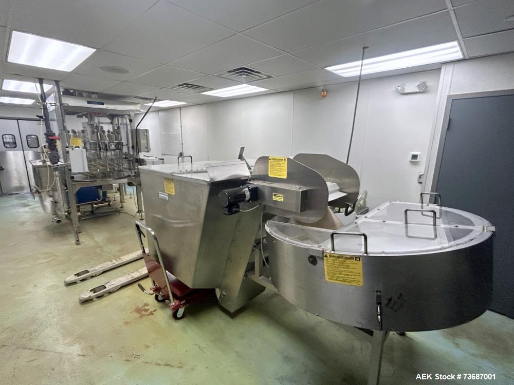 Used Kaps-All Model AU-6 Automatic Plastic Bottle Unscrambler. Capable of speeds up to 300 per minute, depending on size and shape of container. Container size range: 1/16oz to 32oz capable of orient...