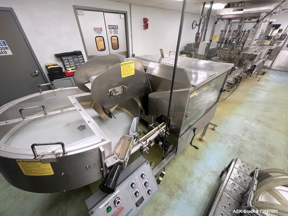 Used Kaps-All Model AU-6 Automatic Plastic Bottle Unscrambler. Capable of speeds up to 300 per minute, depending on size and shape of container. Container size range: 1/16oz to 32oz capable of orient...