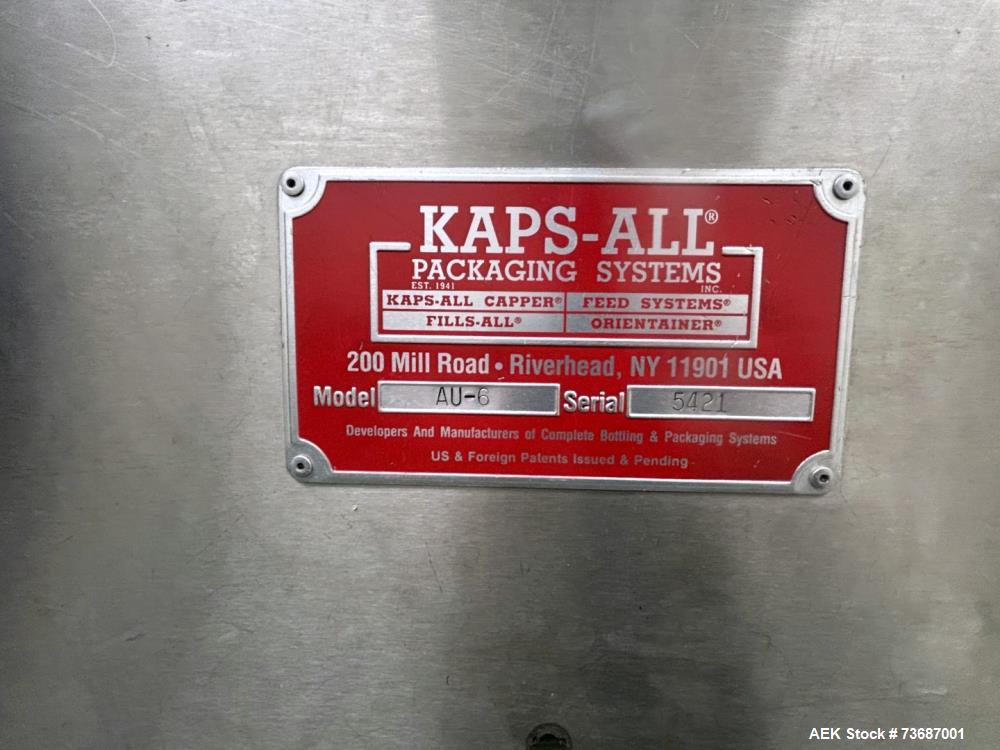 Used Kaps-All Model AU-6 Automatic Plastic Bottle Unscrambler. Capable of speeds up to 300 per minute, depending on size and shape of container. Container size range: 1/16oz to 32oz capable of orient...