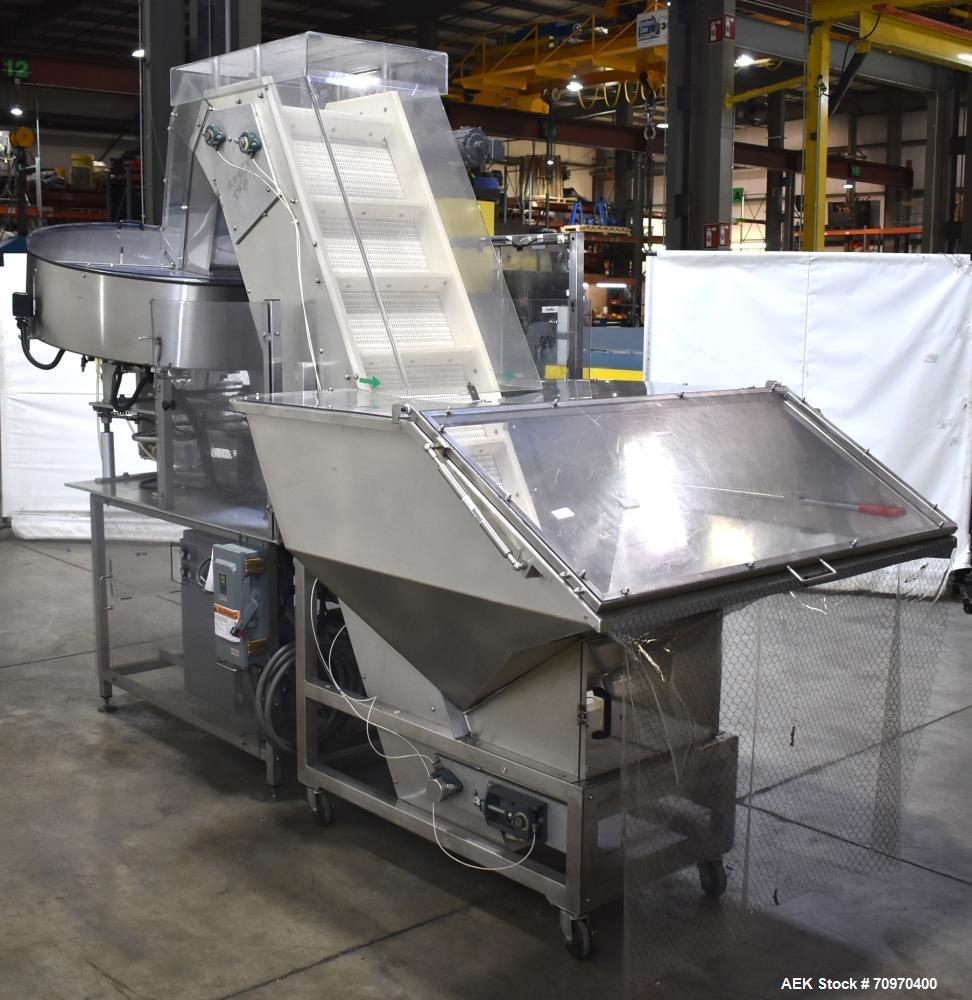 Used New England Machinery Model NEHCL-200AJ Bulk Bottle Unscrambler. Machine is capable of speeds up to 200 bottles per minute. Container size range: Diameter 5/8" - 3-1/2"; Height up to 10". Has in...