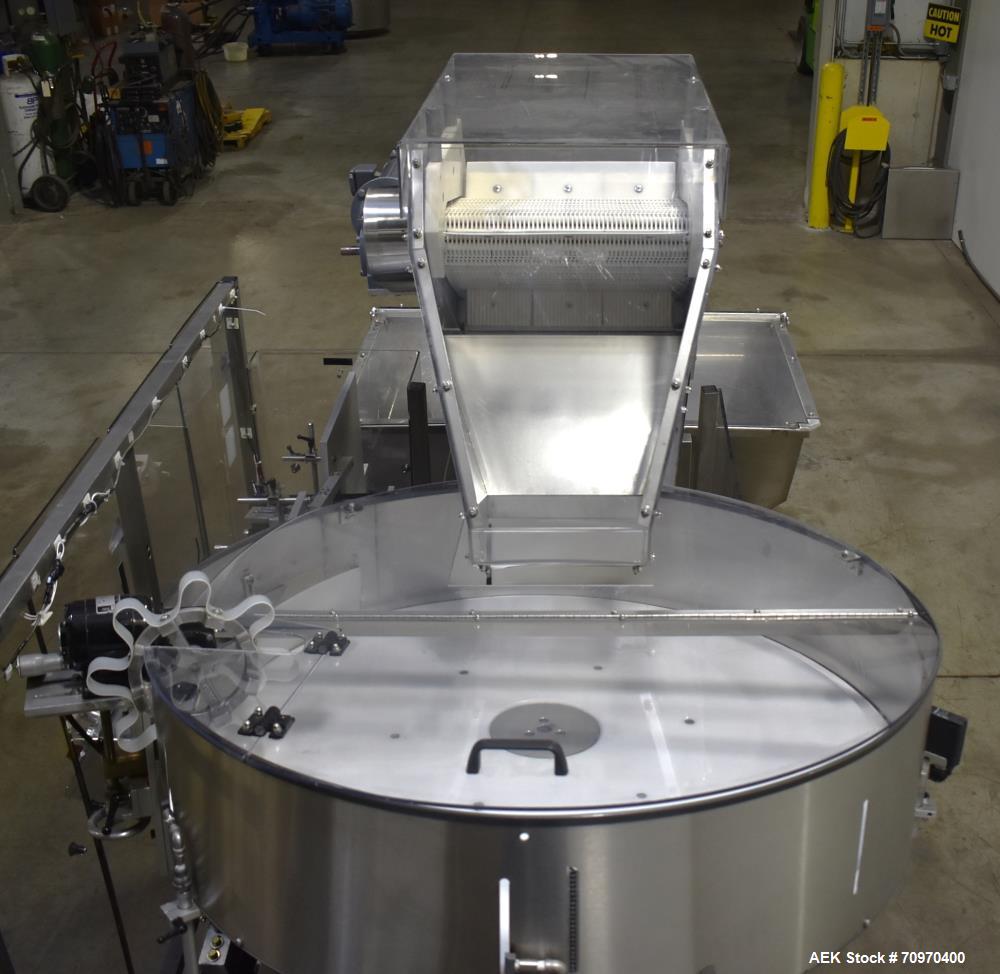 Used New England Machinery Model NEHCL-200AJ Bulk Bottle Unscrambler. Machine is capable of speeds up to 200 bottles per minute. Container size range: Diameter 5/8" - 3-1/2"; Height up to 10". Has in...