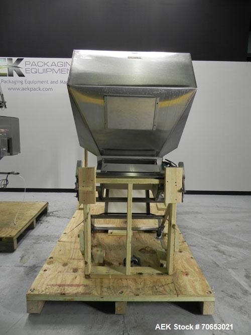 Used New England Model NEHCL-250AJ Bulk Bottle Unscrambler. Has integrated ionized air cleaner. Was last running 45 cc and 60 cc plastic pharmaceutical grade bottles. Includes New England model H/E-1...