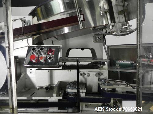 Used New England Model NEHCL-250AJ Bulk Bottle Unscrambler. Has integrated ionized air cleaner. Was last running 45 cc and 60 cc plastic pharmaceutical grade bottles. Includes New England model H/E-1...