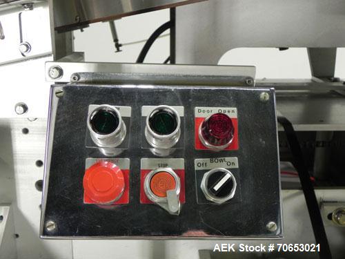 Used New England Model NEHCL-250AJ Bulk Bottle Unscrambler. Has integrated ionized air cleaner. Was last running 45 cc and 60 cc plastic pharmaceutical grade bottles. Includes New England model H/E-1...