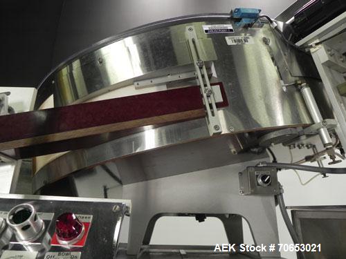 Used New England Model NEHCL-250AJ Bulk Bottle Unscrambler. Has integrated ionized air cleaner. Was last running 45 cc and 60 cc plastic pharmaceutical grade bottles. Includes New England model H/E-1...