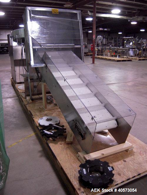 Used New England NECHL350AJ Bulk Plastic Bottle Unscrambler. Includes ionized air cleaner. Has 36" diameter sorting bowl, all stainless steel enclosure, Lexan guarding, bulk bottle elevator. Speeds u...