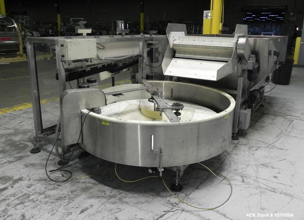 Used New England Model NEHHLP-72 Bottle Unscrambler. Has 72" (diameter) sorting bowl. Is currently set for 36 oz rectangular bottles. Includes New England 100-H/E Hopper. Low profile design and stain...