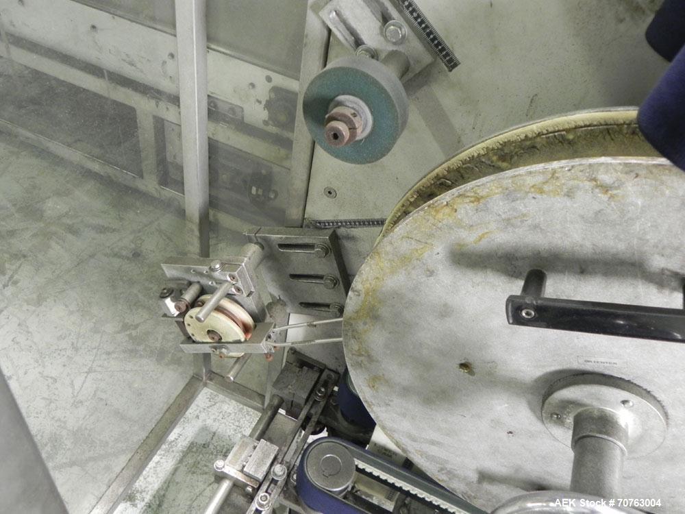 Used New England Model NEHHLP-72 Bottle Unscrambler. Has 72" (diameter) sorting bowl. Is currently set for 36 oz rectangular bottles. Includes New England 100-H/E Hopper. Low profile design and stain...