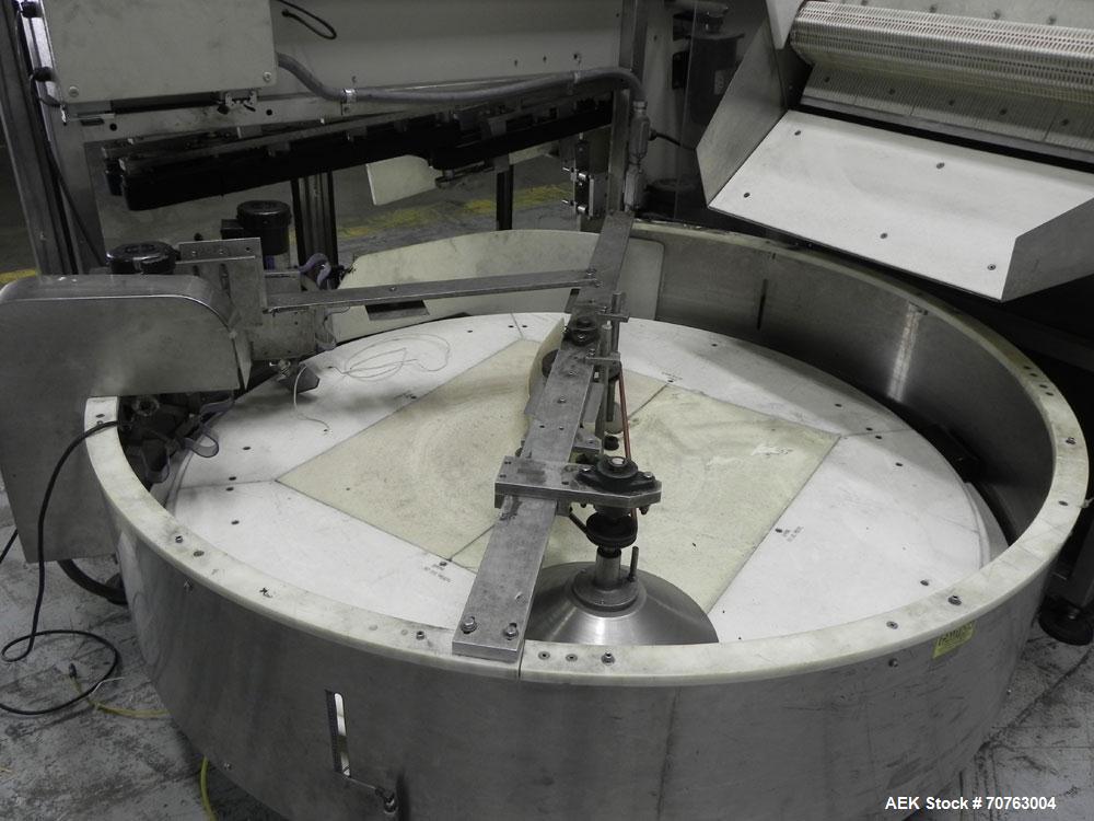 Used New England Model NEHHLP-72 Bottle Unscrambler. Has 72" (diameter) sorting bowl. Is currently set for 36 oz rectangular bottles. Includes New England 100-H/E Hopper. Low profile design and stain...