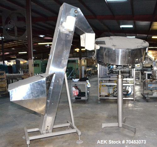 Used Mengibar 44” Diameter Bottle Unscrambler, Model MI-2, Serial #306015, Built 1997. Includes an integrated elevator, model EC300/2000, serial #306015. SELLING PRICE AS IS, WHERE IS, SANFORD, NC.