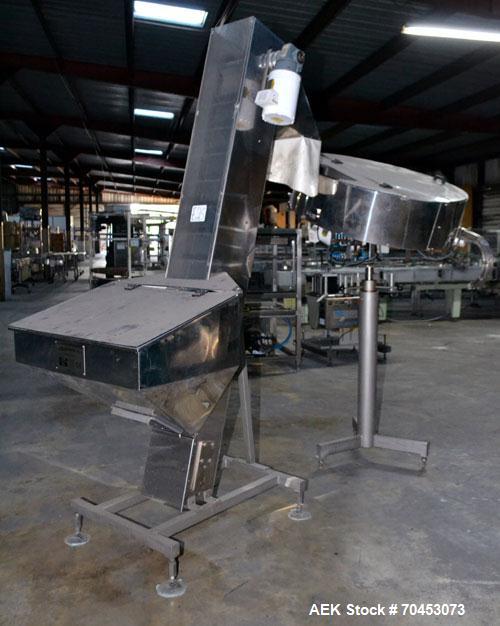 Used Mengibar 44” Diameter Bottle Unscrambler, Model MI-2, Serial #306015, Built 1997. Includes an integrated elevator, model EC300/2000, serial #306015. SELLING PRICE AS IS, WHERE IS, SANFORD, NC.