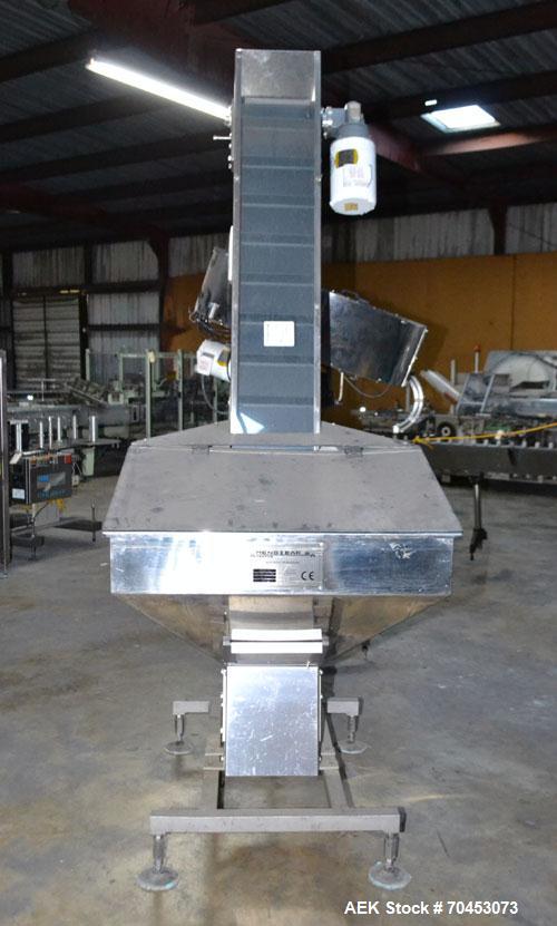 Used Mengibar 44” Diameter Bottle Unscrambler, Model MI-2, Serial #306015, Built 1997. Includes an integrated elevator, model EC300/2000, serial #306015. SELLING PRICE AS IS, WHERE IS, SANFORD, NC.