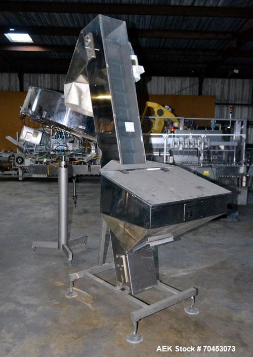 Used Mengibar 44” Diameter Bottle Unscrambler, Model MI-2, Serial #306015, Built 1997. Includes an integrated elevator, model EC300/2000, serial #306015. SELLING PRICE AS IS, WHERE IS, SANFORD, NC.