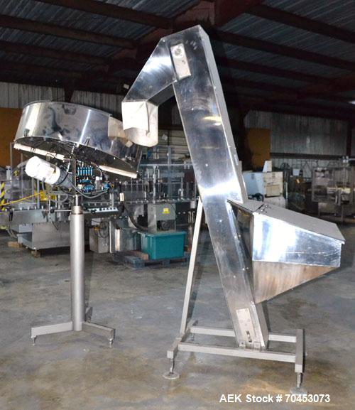 Used Mengibar 44” Diameter Bottle Unscrambler, Model MI-2, Serial #306015, Built 1997. Includes an integrated elevator, model EC300/2000, serial #306015. SELLING PRICE AS IS, WHERE IS, SANFORD, NC.