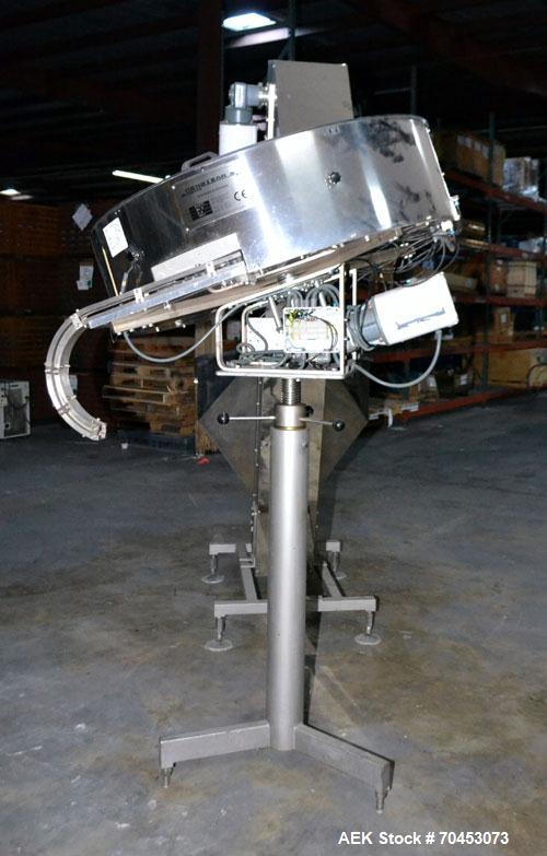 Used Mengibar 44” Diameter Bottle Unscrambler, Model MI-2, Serial #306015, Built 1997. Includes an integrated elevator, model EC300/2000, serial #306015. SELLING PRICE AS IS, WHERE IS, SANFORD, NC.