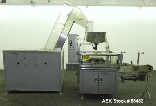 Used Omega Design Bottle Unscrambler, Model 2D1RPC8. 8 Station, Allen-Bradley SLC 5/03 PLC controls. Air cleaner, has Palace bottle elevator with 12" x 12" x 3" high cleats, approximate 72" discharge...
