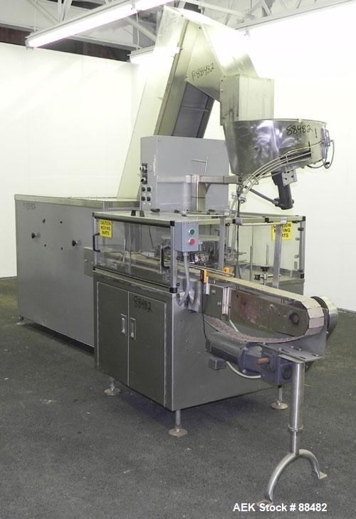 Used Omega Design Bottle Unscrambler, Model 2D1RPC8. 8 Station, Allen-Bradley SLC 5/03 PLC controls. Air cleaner, has Palace bottle elevator with 12" x 12" x 3" high cleats, approximate 72" discharge...