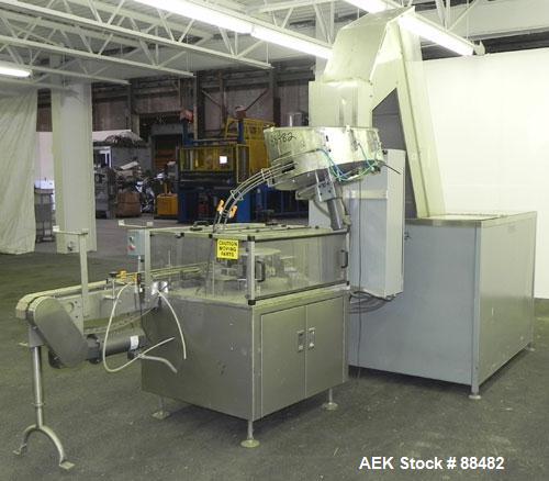 Used Omega Design Bottle Unscrambler, Model 2D1RPC8. 8 Station, Allen-Bradley SLC 5/03 PLC controls. Air cleaner, has Palace bottle elevator with 12" x 12" x 3" high cleats, approximate 72" discharge...