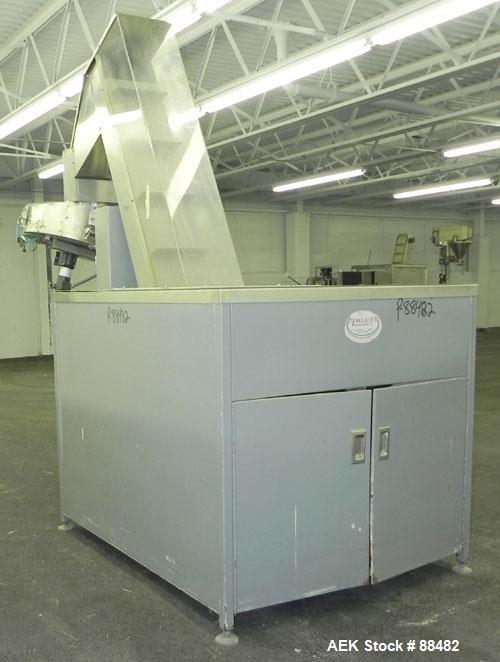 Used Omega Design Bottle Unscrambler, Model 2D1RPC8. 8 Station, Allen-Bradley SLC 5/03 PLC controls. Air cleaner, has Palace bottle elevator with 12" x 12" x 3" high cleats, approximate 72" discharge...