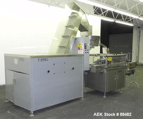 Used Omega Design Bottle Unscrambler, Model 2D1RPC8. 8 Station, Allen-Bradley SLC 5/03 PLC controls. Air cleaner, has Palace bottle elevator with 12" x 12" x 3" high cleats, approximate 72" discharge...