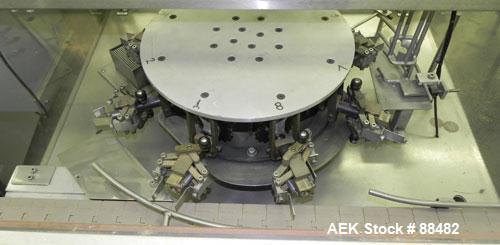 Used Omega Design Bottle Unscrambler, Model 2D1RPC8. 8 Station, Allen-Bradley SLC 5/03 PLC controls. Air cleaner, has Palace bottle elevator with 12" x 12" x 3" high cleats, approximate 72" discharge...