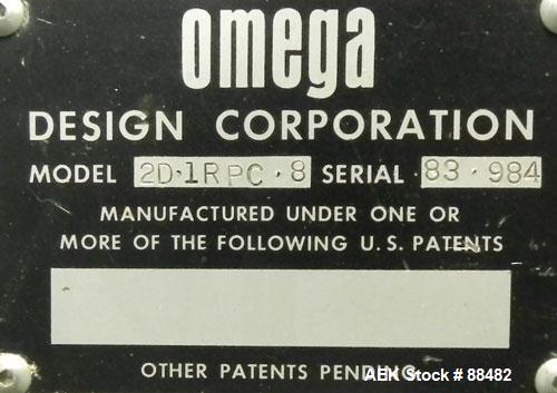 Used Omega Design Bottle Unscrambler, Model 2D1RPC8. 8 Station, Allen-Bradley SLC 5/03 PLC controls. Air cleaner, has Palace bottle elevator with 12" x 12" x 3" high cleats, approximate 72" discharge...