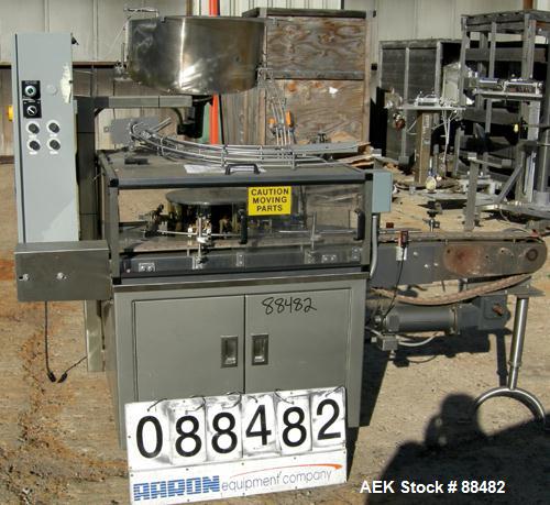 Used Omega Design Bottle Unscrambler, Model 2D1RPC8. 8 Station, Allen-Bradley SLC 5/03 PLC controls. Air cleaner, has Palace bottle elevator with 12" x 12" x 3" high cleats, approximate 72" discharge...