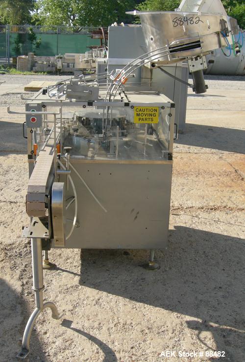 Used Omega Design Bottle Unscrambler, Model 2D1RPC8. 8 Station, Allen-Bradley SLC 5/03 PLC controls. Air cleaner, has Palace bottle elevator with 12" x 12" x 3" high cleats, approximate 72" discharge...
