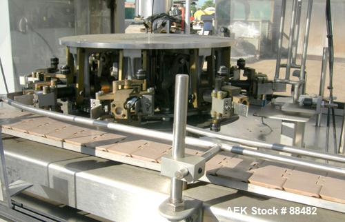 Used Omega Design Bottle Unscrambler, Model 2D1RPC8. 8 Station, Allen-Bradley SLC 5/03 PLC controls. Air cleaner, has Palace bottle elevator with 12" x 12" x 3" high cleats, approximate 72" discharge...