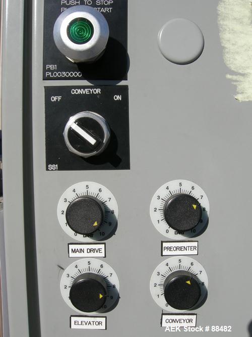 Used Omega Design Bottle Unscrambler, Model 2D1RPC8. 8 Station, Allen-Bradley SLC 5/03 PLC controls. Air cleaner, has Palace bottle elevator with 12" x 12" x 3" high cleats, approximate 72" discharge...
