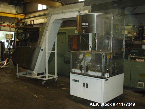 Used Omega Design Bulk Bottle Unscrambler, Model 4D-RP2-18. Capable of speeds over 250 BPM. Has exterior bottle air cleaner, bulk bottle elevator. 1/60/120V.