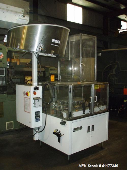 Used Omega Design Bulk Bottle Unscrambler, Model 4D-RP2-18. Capable of speeds over 250 BPM. Has exterior bottle air cleaner, bulk bottle elevator. 1/60/120V.