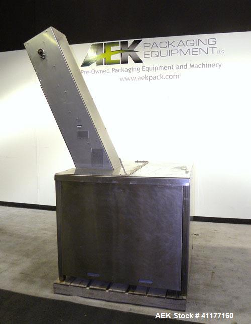 Used Omega Design feeder for Bottle Unscrambler,model H-1-18 bulk bottle elevator. Last running 15, 30, 60cc plastic bottles.
